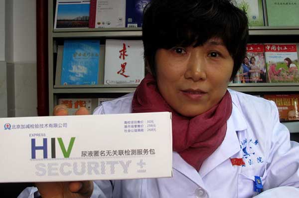 A doctor at Southwest Petroleum University shows an HIV test kit available for purchase on campus.Huang Zhiling / China Daily