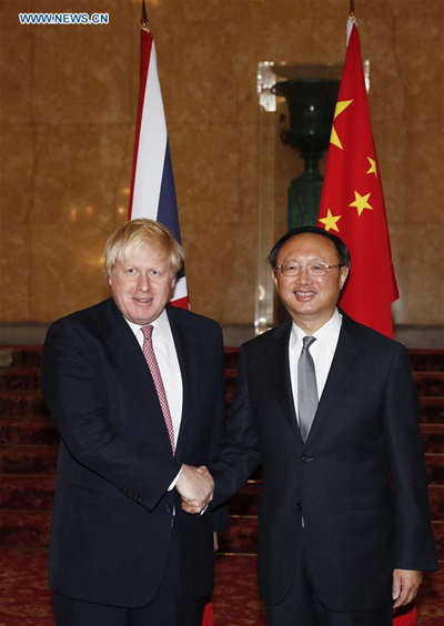 Visiting Chinese State Councilor Yang Jiechi (R) shakes hands with British Foreign Secretary Boris Johnson before the eighth China-UK Strategic Dialogue in London, Britain, on Dec. 20, 2016. (Photo: Xinhua/Han Yan)
