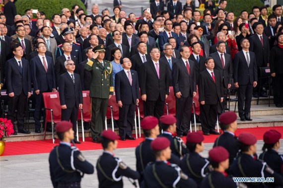Chui Sai On (3rd R F), chief executive of Macao Special Administrative Region, Wang Zhimin (3rd L F), head of the Liaison Office of the Central People's Government in Macao, and Ye Dabo (2nd R F), commissioner of the Ministry of Foreign Affairs in Macao, attend a flag-raising ceremony held to celebrate the 17th anniversary of Macao's return to the motherland in Macao, south China, Dec. 20, 2016. (Photo: Xinhua/Cheong Kam Ka)