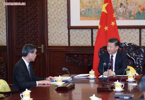 Chinese PresidentXi Jinping(R) meets with Hong Kong Special Administrative Region (SAR) Chief Executive Leung Chun-ying in Beijing, capital of China, Dec. 23, 2016. Leung is in Beijing to report to the central government on his work in 2016. (Xinhua/Ju Peng)