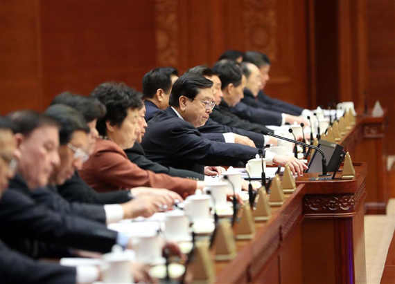 Zhang Dejiang, chairman of the Standing Committee of China's National People's Congress (NPC), votes at the closing meeting of the 25th session of the 12th NPC Standing Committee in Beijing, capital of China, Dec. 25, 2016. (Photo: Xinhua/Liu Weibing)