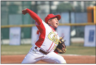 Chinese player Yun Yongteng, 11, from Dongsheng township, pitches a ball at the 9th Asian U12 Baseball Championship held in Zhongshan, Guangdong province.Qiu Quanlin / China Daily