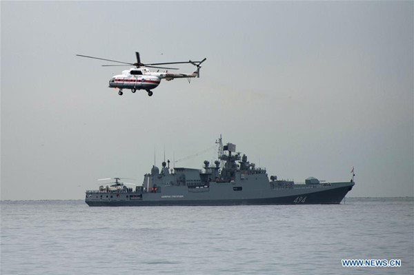 Photo taken on Dec. 27, 2016 shows a navy ship and a helicopter taking part in a rescue operation on the Black Sea coast at the crash site of Russian Defense Ministry's Tu-154 aircraft near Sochi, Russia. The main flight recorder of the Russian military Tu-154 aircraft that crashed Sunday into the Black Sea has been retrieved from the wreckage, the Russian Defense Ministry said Tuesday. (Xinhua/Sputnik)