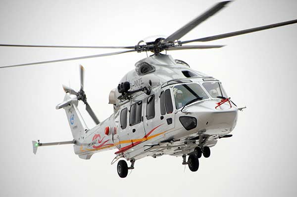 An AC352 utility helicopter is seen during its maiden flight on Tuesday. (Photo/China Daily)