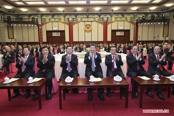 Top Communist Party of China (CPC) and state leaders Xi Jinping (C front), Li Keqiang (3rd R front), Zhang Dejiang (3rd L front), Yu Zhengsheng (2nd R front), Liu Yunshan(2nd L front), Wang Qishan (1st R front) and Zhang Gaoli (1st L front) attend a New Year gathering held by the Chinese People's Political Consultative Conference (CPPCC) National Committee in Beijing, capital of China, Dec 30, 2016. (Photo/Xinhua)