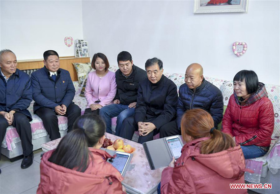 Chinese Vice Premier Wang Yang (back 3rd R) talks to villagers during an inspection in a village in Gaoliying Township, to learn about the on-site registration of the third national agricultural census here, in Beijing, capital of China, Jan. 1, 2017. (Xinhua/Li Xueren)