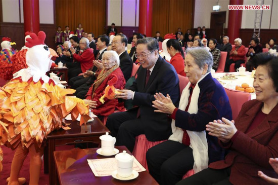 Yu Zhengsheng, chairman of the National Committee of Chinese People's Political Consultative Conference (CPPCC), attends a Spring Festival reception for widows of luminaries and national political advisors who were not members of the Communist Party of China, in Beijing, China, Jan. 9, 2017. (Xinhua/Pang Xinglei)