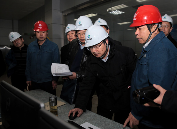Environmental inspectors dispatched by the central government examine a polluting power plant in Heze, Shandong province, in December.Cai Yang/ Xinhua