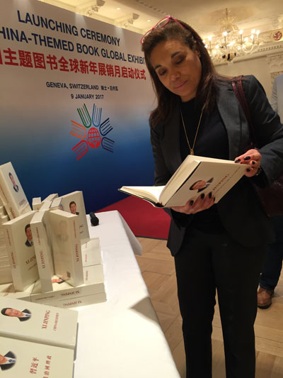 At a book exhibition launch ceremony held in Geneva on Monday, vice-president of the Swiss Journalist Club Catherine Fiankan-Bokonga says President Xi Jinpings book The Governance of China could help her understand China.  (Photo by Fu Jing/chinadaily.com.cn)