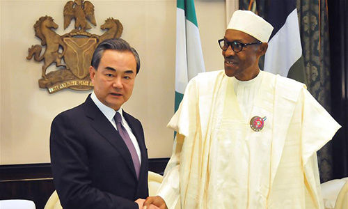 Nigerian President Muhammadu Buhari (R) meets with Chinese Foreign Minister Wang Yi in Abuja, Nigeria, on Jan. 11, 2017. The Nigerian government reaffirmed its commitment to One-China policy on Wednesday, saying Nigeria will stay committed to the long-standing friendship and cooperation with China. (Xinhua/Zhang Baoping)