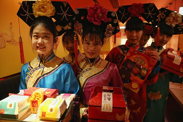 The McDonald's holds an event to promote its New Year menu. (Photo by Jiang Dong/China Daily)