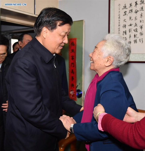 Liu Yunshan (L), a member of the Standing Committee of the Political Bureau of the Communist Party of China (CPC) Central Committee, visits film artist Yu Lan in Beijing, capital of China, Jan. 17, 2017. (Xinhua/Li Tao)
