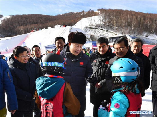 Chinese President Xi Jinping encourages children attending skiing winter camps at Genting Ski Resort as he inspects preparatory work for Beijing 2022 Winter Olympic Games in Zhangjiakou City, north China's Hebei Province, Jan. 23, 2017. (Xinhua/Li Tao)