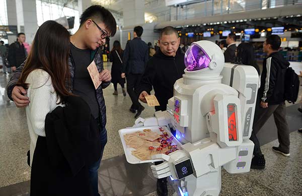 A robot provides consulting services to passengers at an airport in Guangzhou, Guangdong province, early this month.Lin Guiyan / For China Daily
