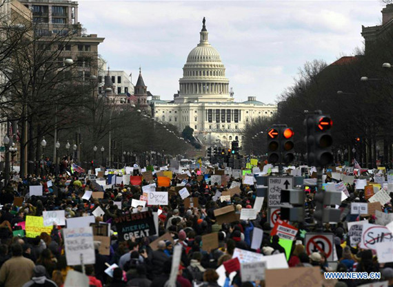 Demonstrators participating in a protest against U.S. President Donald Trump's executive order temporarily barring all refugees and seven Mideast and North African countries' citizens from entry into the U.S. march towards Capitol Hill in Washington D.C., the Unite States, on Jan. 29, 2017. Photo/Xinhua