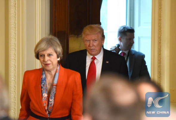 U.S. President Donald Trump and British Prime Minister Theresa May(front) arrive for a joint press conference at the White House in Washington D.C., the United States, Jan. 27, 2017. (Xinhua/Yin Bogu)