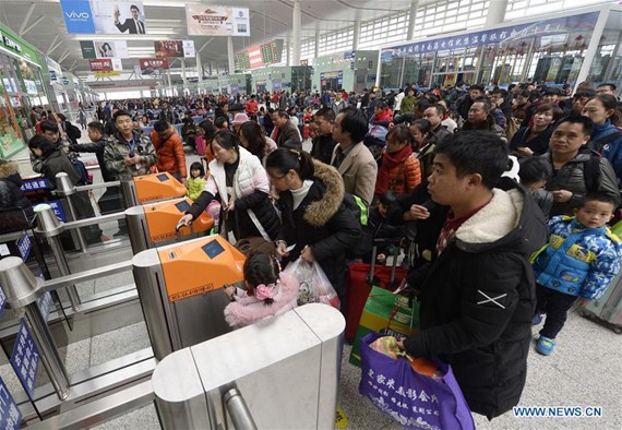 Passengers enter the Nanchang West Railway Station in Nanchang, capital of east China's Jiangxi Province, Feb. 1, 2017. After the Chinese Lunar New Year, the Nanchang West Railway Station witnessed a travel peak on Wednesday as people started to travel to other cities for school and work. (Xinhua/Peng Zhaozhi)