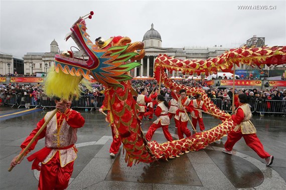 People watch dragon dance to celebrate the Chinese Lunar New Year at Trafalgar Square in London, Britain, on Jan. 29, 2017. (Xinhua/Tim Ireland)
