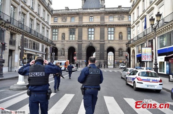 French police officers patrol near the Louvre museum on February 3, 2017 in Paris after a soldier has shot and gravely injured a man who tried to attack him. Serious public security incident under way in Paris in the Louvre area, the interior ministry tweeted on February 3 as streets in the area were cordoned off to traffic and pedestrians. (Photo/Agencies)