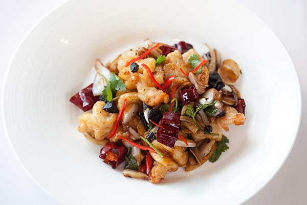 Habanero chicken at QMex features one of the hottest chilies available; wokfried prawns with dried chilies pack some heat at Lung King Heen in Hong Kong's Four Seasons Hotel.(Photo provided to China Daily)
