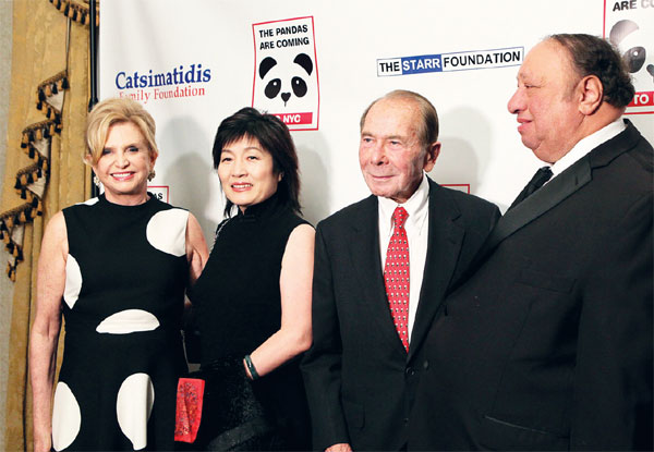 From left: U.S. Congresswoman Carolyn Maloney; Zhang Qiyue, China's consul general in New York; Maurice Greenberg, chairman of C.V. Starr; and supermarket magnate John Catsimatidis pose for photos at the Black and White Panda Ball on Wednesday at the Waldorf Astoria hotel in New York. The ball was held to raise funds to bring two pandas to Central Park by 2020. (Photo: Hezi Jiang/China Daily)