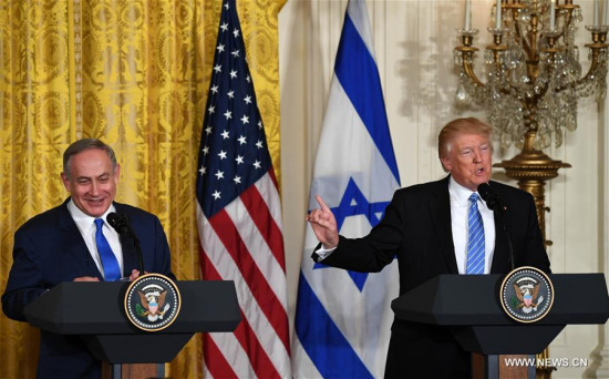 U.S. President Donald Trump (R) gestures at a joint press conference with visiting Israeli Prime Minister Benjamin Netanyahu at the White House in Washington D.C., the United States, on Feb. 15, 2017. (Xinhua/Yin Bogu)