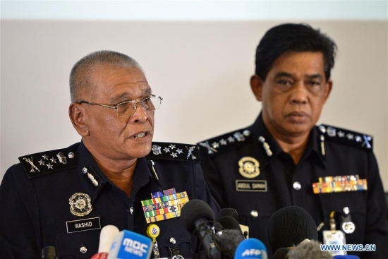 Malaysia's Deputy Inspector-General of Police Noor Rashid Ibrahim (L) speaks at a press conference held in Kuala Lumpur, Malaysia, on Feb. 19, 2017. (Xinhua/Chong Voon Chung)