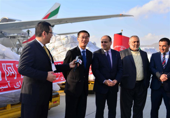 Chinese Ambassador to Afghanistan Yao Jing (2nd L) and Afghan State Minister for Disaster Management and Humanitarian Affairs Wais Ahmad Barmak (3rd L) attend the handover ceremony of humanitarian consignments at an airport in Kabul, Afghanistan, on Feb. 19, 2017. (Xinhua/Dai He)