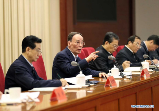 Wang Qishan (2nd L) , a member of the Standing Committee of the Political Bureau of the Communist Party of China (CPC) Central Committee, who also heads an inspection leadership group of the CPC Central Committee, attends a meeting before the launch of the 12th round of inspections in Beijing, capital of China, Feb. 22, 2017. (Xinhua/Liu Weibing)