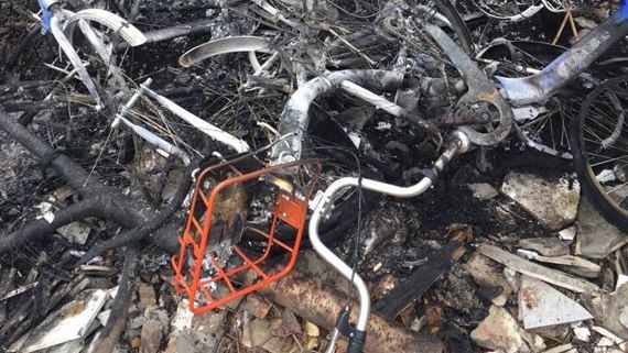 Public shared bikes are badly disfigured by torching . (Photo/CGTN)