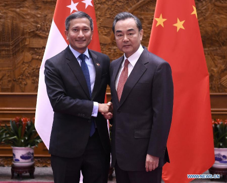 Chinese Foreign Minister Wang Yi (R) meets with Singapore's Minister for Foreign Affairs Vivian Balakrishnan in Beijing, capital of China, Feb. 27, 2017. (Xinhua/Yan Yan)
