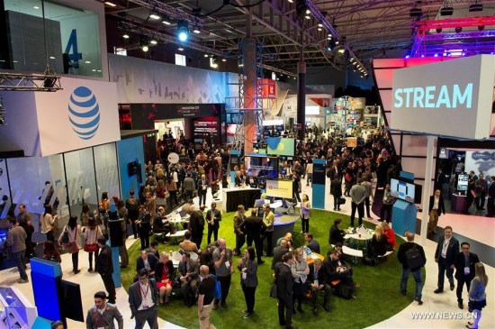 People visit the exhibition during the second day of the Mobile World Congress in Barcelona, Spain, on Feb. 28, 2017. (Xinhua/Lino De Vallier)