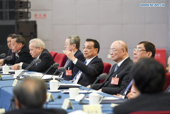 Chinese Premier Li Keqiang joins a panel discussion with political advisors from economic and agricultural sectors at the fifth session of the 12th National Committee of the Chinese People's Political Consultative Conference (CPPCC) in Beijing, capital of China, March 4, 2017. (Xinhua/Li Xueren)