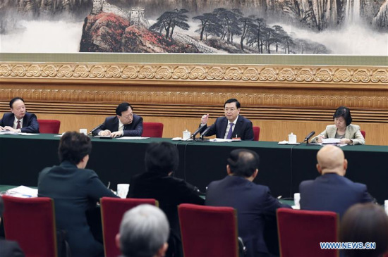 Zhang Dejiang, chairman of the Standing Committee of China's National People's Congress (NPC), joins a panel discussion with deputies to the 12th NPC from Zhejiang Province at the annual session of the NPC in Beijing, capital of China, March 5, 2017. (Xinhua/Gao Jie)