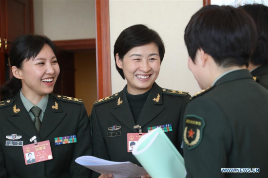 Astronaut Liu Yang (2nd L), a deputy to the 12th National People's Congress (NPC) from the People's Liberation Army, is seen during a break of a panel discussion of the annual session of the NPC in Beijing, capital of China, March 7, 2017. (Xinhua/Li Gang)