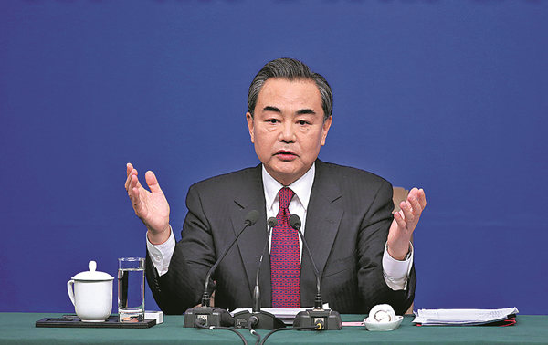 Foreign Minister Wang Yi discusses China-US ties at a news conference during the annual session of the National People's Congress in Beijing on Wednesday. Feng Yongbin / China Daily