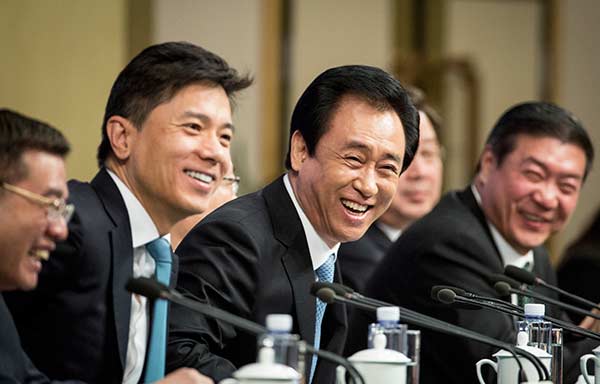 CPPCC members Xu Jiayin (center) and Wang Wenbiao (at right) attend a news conference at the fifth session of the 12th CPPCC National Committee on improving people's livelihoods in Beijing on Thursday. KUANG LINHUA/CHINA DAILY