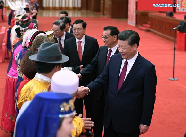 Top Communist Party of China and state leaders Xi Jinping, Li Keqiang, Zhang Dejiang, Yu Zhengsheng, Liu Yunshan, Wang Qishan and Zhang Gaoli attend a gathering with ethnic minority deputies to the 12th National People's Congress (NPC) and ethnic minority members of the 12th National Committee of the Chinese People's Political Consultative Conference (CPPCC) on the sidelines of the ongoing annual sessions of the NPC and the CPPCC National Committee at the Great Hall of the People in Beijing, capital of China, March 11, 2017. (Xinhua/Li Xueren)