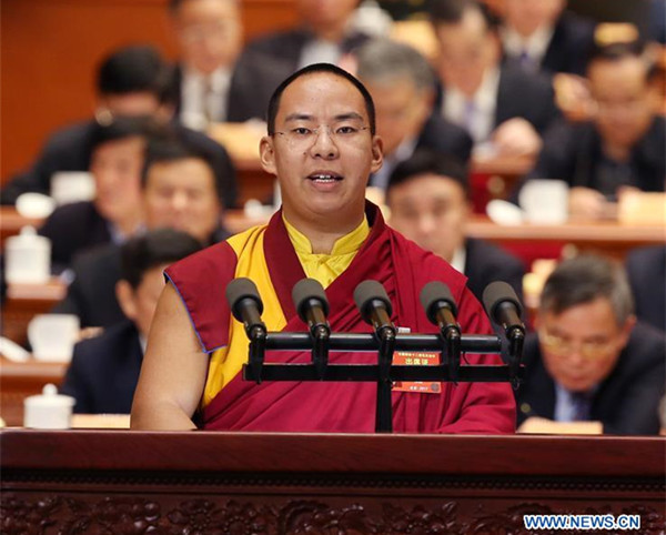 The 11th Panchen Lama Bainqen Erdini Qoigyijabu, a member of the 12th National Committee of the Chinese People's Political Consultative Conference (CPPCC), delivers a speech at the fourth plenary meeting of the fifth session of the 12th CPPCC National Committee in the Great Hall of the People in Beijing, capital of China, March 11, 2017. (Xinhua/Yao Dawei)