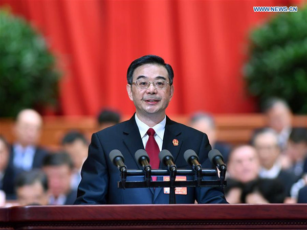 Chief Justice Zhou Qiang delivers a work report of the Supreme People's Court at the third plenary meeting of the fifth session of the 12th National People's Congress at the Great Hall of the People in Beijing, capital of China, March 12, 2017. (Xinhua/Li Tao)