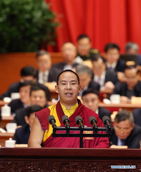 The 11th Panchen Lama Bainqen Erdini Qoigyijabu, a member of the 12th National Committee of the Chinese People's Political Consultative Conference (CPPCC), delivers a speech at the fourth plenary meeting of the fifth session of the 12th CPPCC National Committee in the Great Hall of the People in Beijing, capital of China, March 11, 2017. (Xinhua/Yao Dawei)