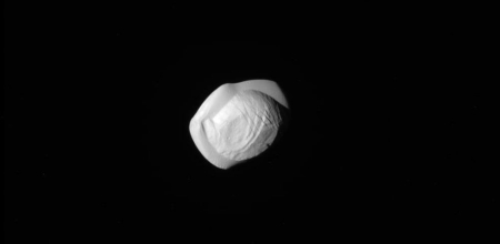 An image of Pan, a moon of Saturn.