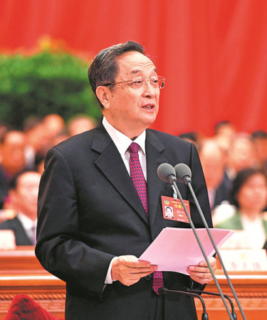 Yu Zhengsheng, chairman of the 12th CPPCC National Committee, addresses members at the closing session in the Great Hall of the People in Beijing on Monday. (Xinhua/Rao Aimin)