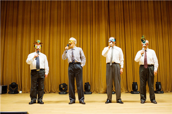 Four members of the vocal group Suiyuan Old Boys wear masks while performing on stage in Hangzhou, Zhejiang province. (Photo provided to China Daily)