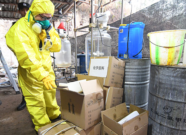 Police officers inspect confiscated drugs worth 30 million yuan ($4.3 million), including 1.7 metric tons of methcathinone, in Nanning, the Guangxi Zhuang autonomous region, in January.Song Bingjia / For China Daily