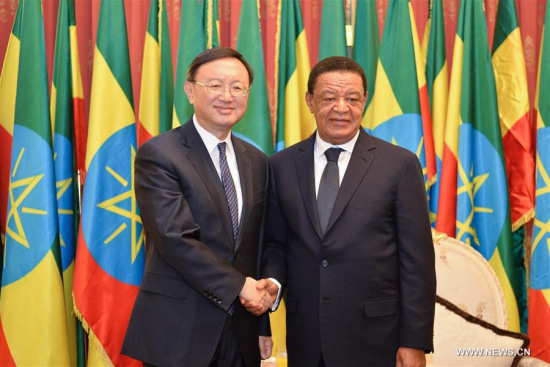 Ethiopian President Mulatu Teshome (R) shakes hands with visiting Chinese State Councilor Yang Jiechi during their meeting in Addis Ababa, Ethiopia, on March 20, 2017. (Xinhua/Michael Tewelde)