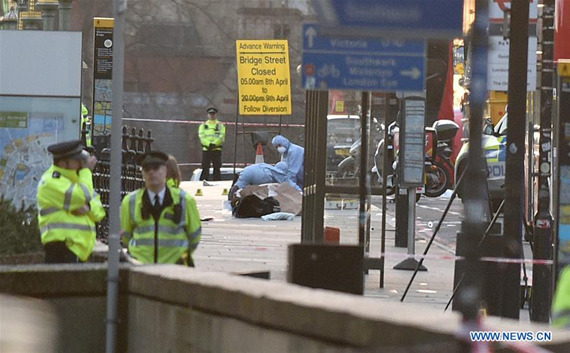 Emergency services staff and forensic officers work on Westminster Bridge in London, Britain on March 22, 2017. (Xinhua/Tim Ireland)