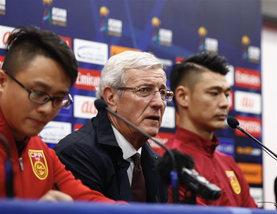 China's head coach Marcello Lippi (C) and goalkeeper Zeng Cheng attend the press conference after the 2018 FIFA World Cup Russia qualification match between China and South Korea in Changsha, central China's Hunan province, March 23, 2017. China won 1-0. (Xinhua/Ding Xu)
