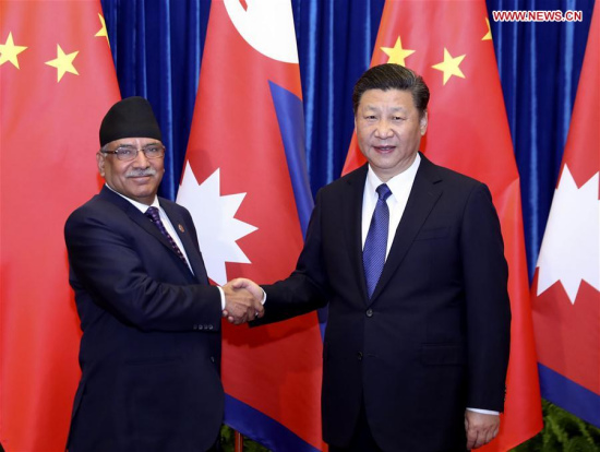 Chinese PresidentXi Jinping(R) meets with Nepali Prime Minister Pushpa Kamal Dahal in Beijing, capital of China, March 27, 2017.(Xinhua/Ding Lin) 