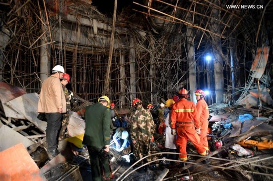 Rescuers work at the accident site after a scaffold collapsed in a construction site of a peony park in Macheng City, central China's Hubei Province, March 28, 2017. (Xinhua/Xiong Qi) 